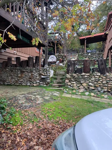 a front view of a house with a lake view