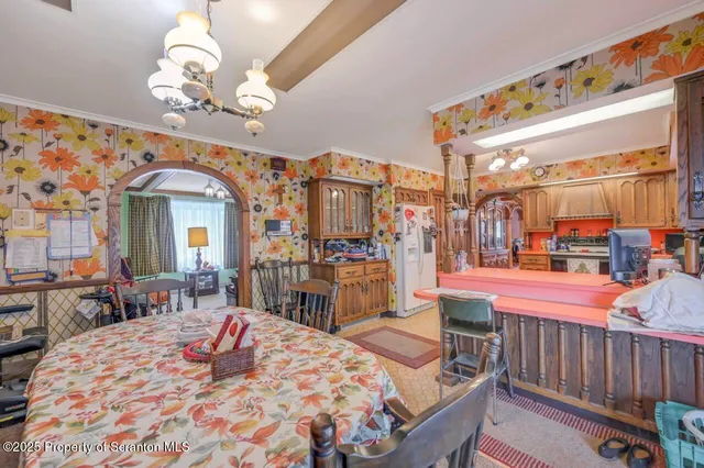 a view of a dining room with furniture and window