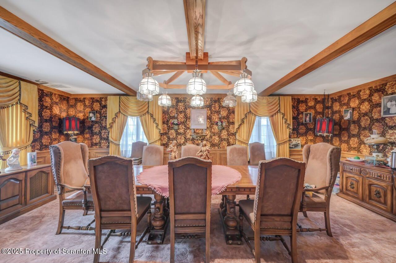 828 Glenwood Road Old Forge, PA 18518 - Photo 27 of 97 a view of a dining room with furniture and chandelier