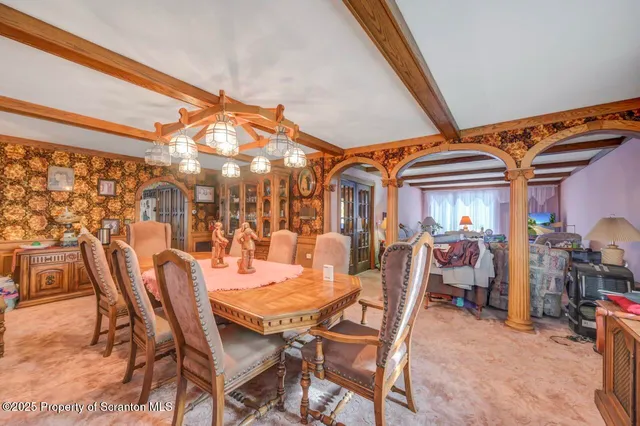 a spacious bedroom with a bed and ceiling fan