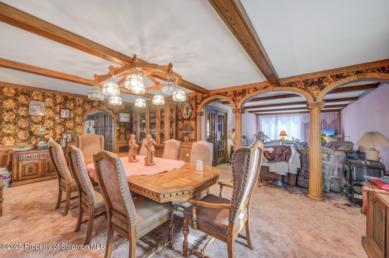 828 Glenwood Road Old Forge, PA 18518 - Photo 31 of 97 a view of a dining room with furniture and chandelier