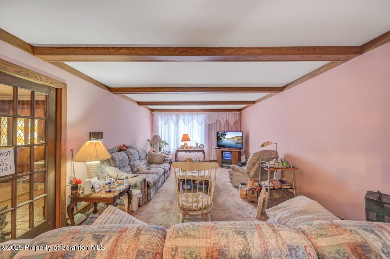 828 Glenwood Road Old Forge, PA 18518 - Photo 32 of 97 a view of a dining room with furniture and chandelier
