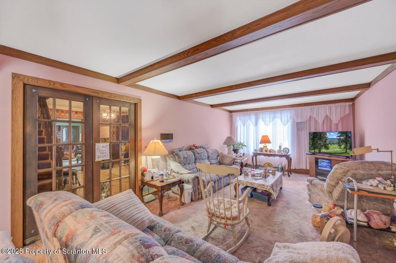828 Glenwood Road Old Forge, PA 18518 - Photo 33 of 97 a living room with furniture and a large window