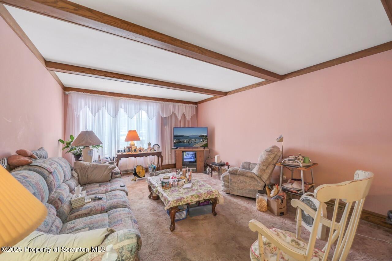 828 Glenwood Road Old Forge, PA 18518 - Photo 34 of 97 a living room with furniture and a large window