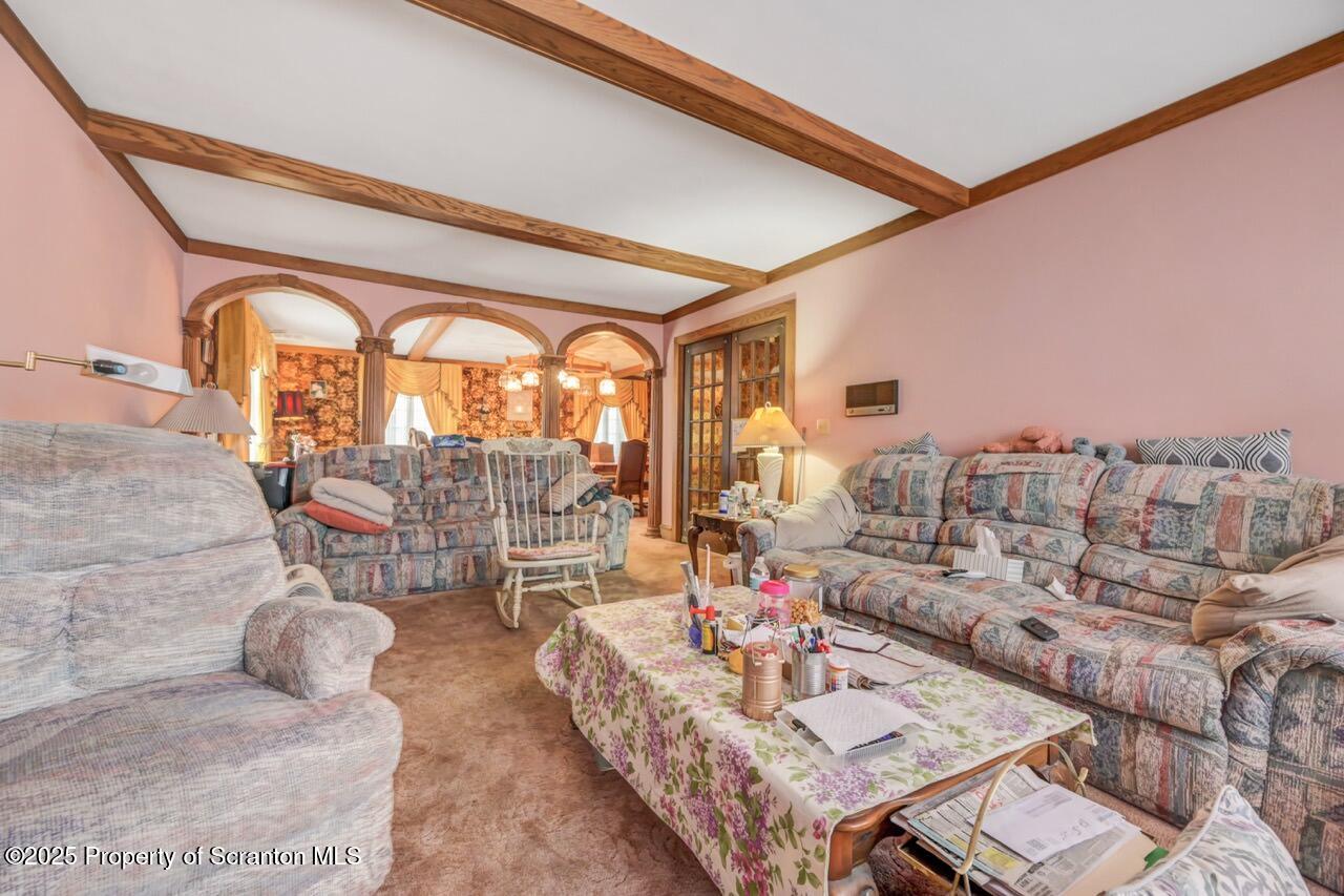 828 Glenwood Road Old Forge, PA 18518 - Photo 35 of 97 a living room with furniture and a large window