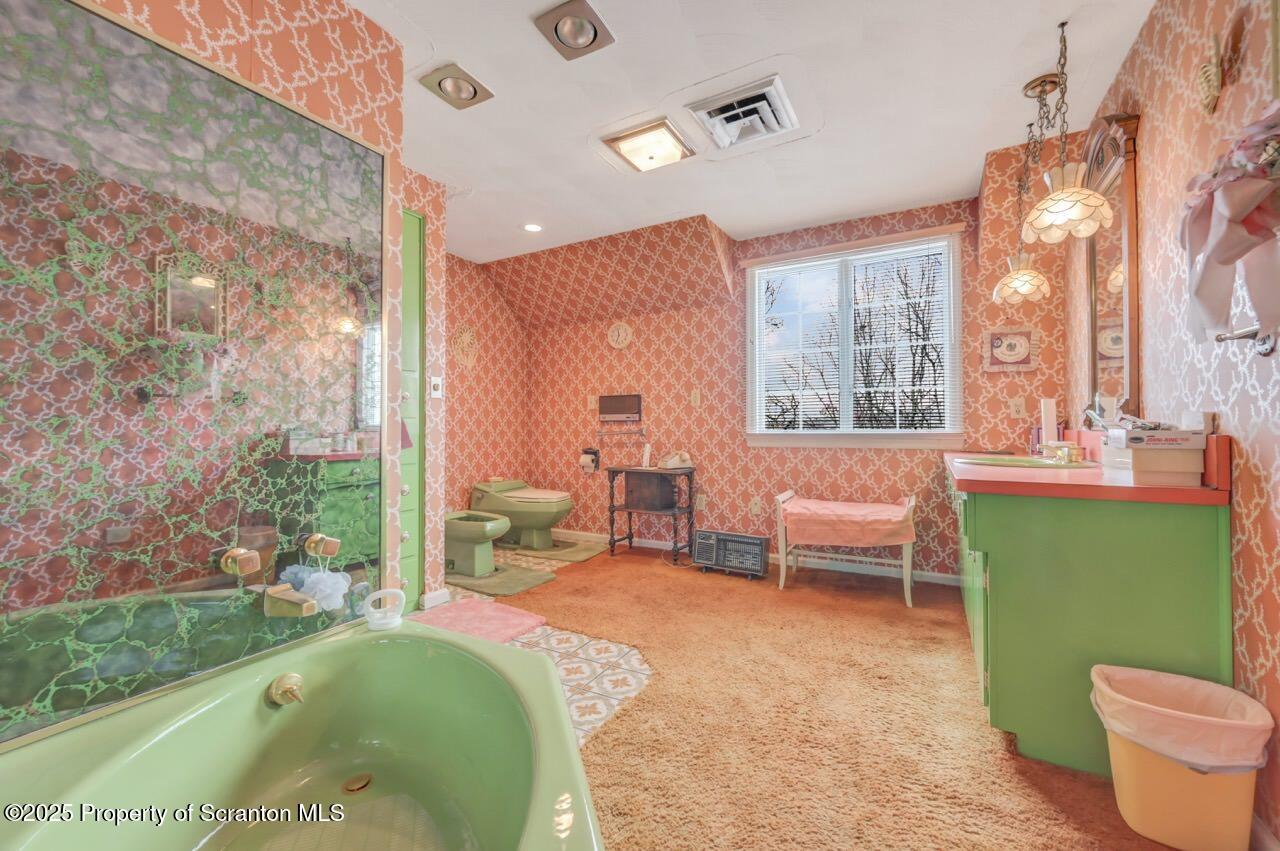 828 Glenwood Road Old Forge, PA 18518 - Photo 47 of 97 a living room with furniture and a garden