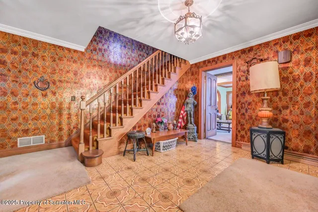 a bed room with a bed mirror and a chandelier