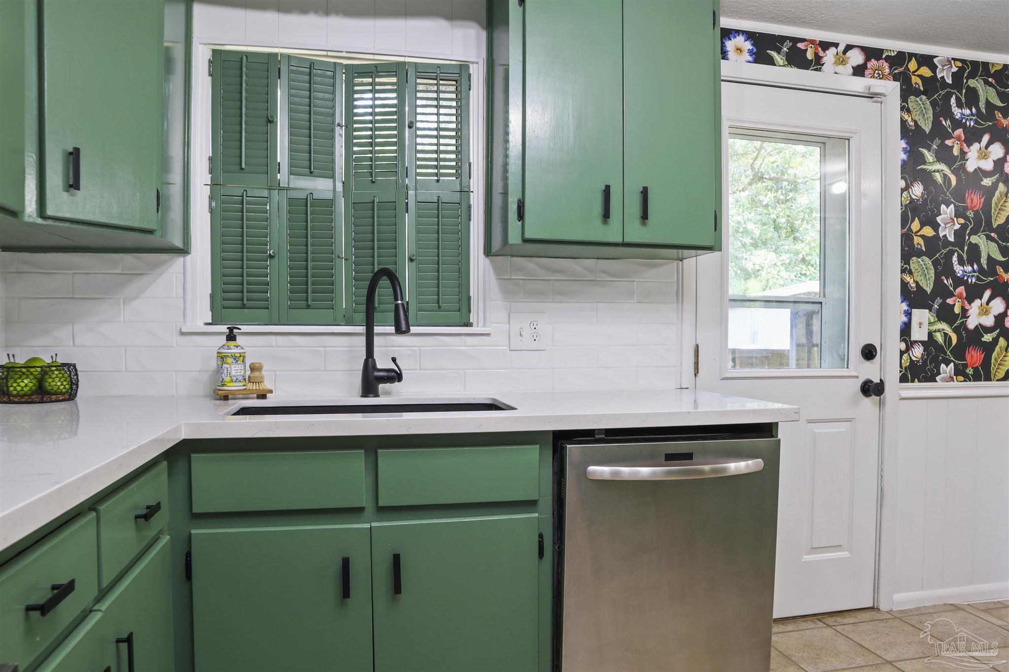 5925 Prince Road Pensacola, FL 32503 - Photo 12 of 51 a kitchen with a sink and a window