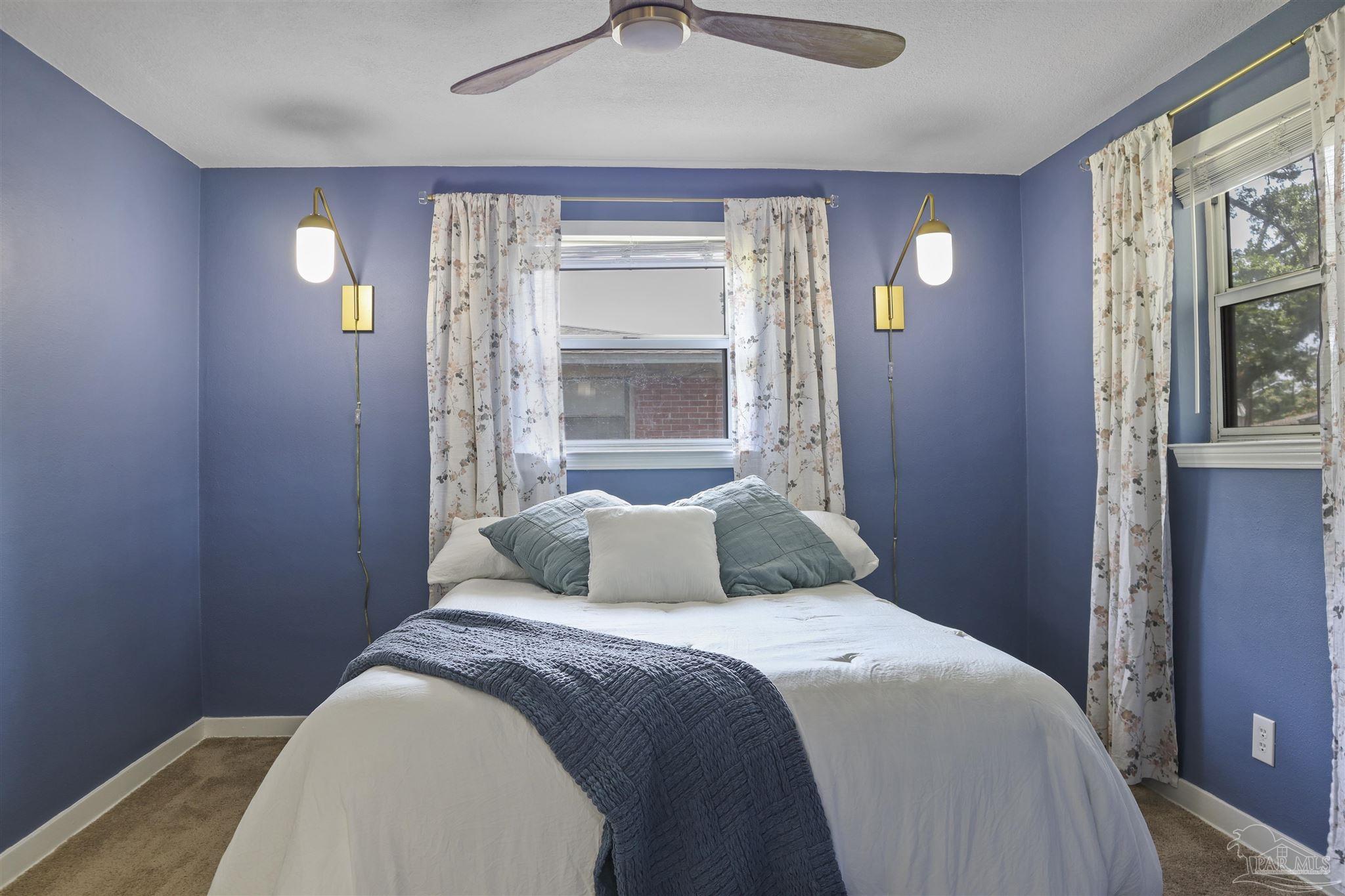 5925 Prince Road Pensacola, FL 32503 - Photo 17 of 51 a bedroom with a bed and a window