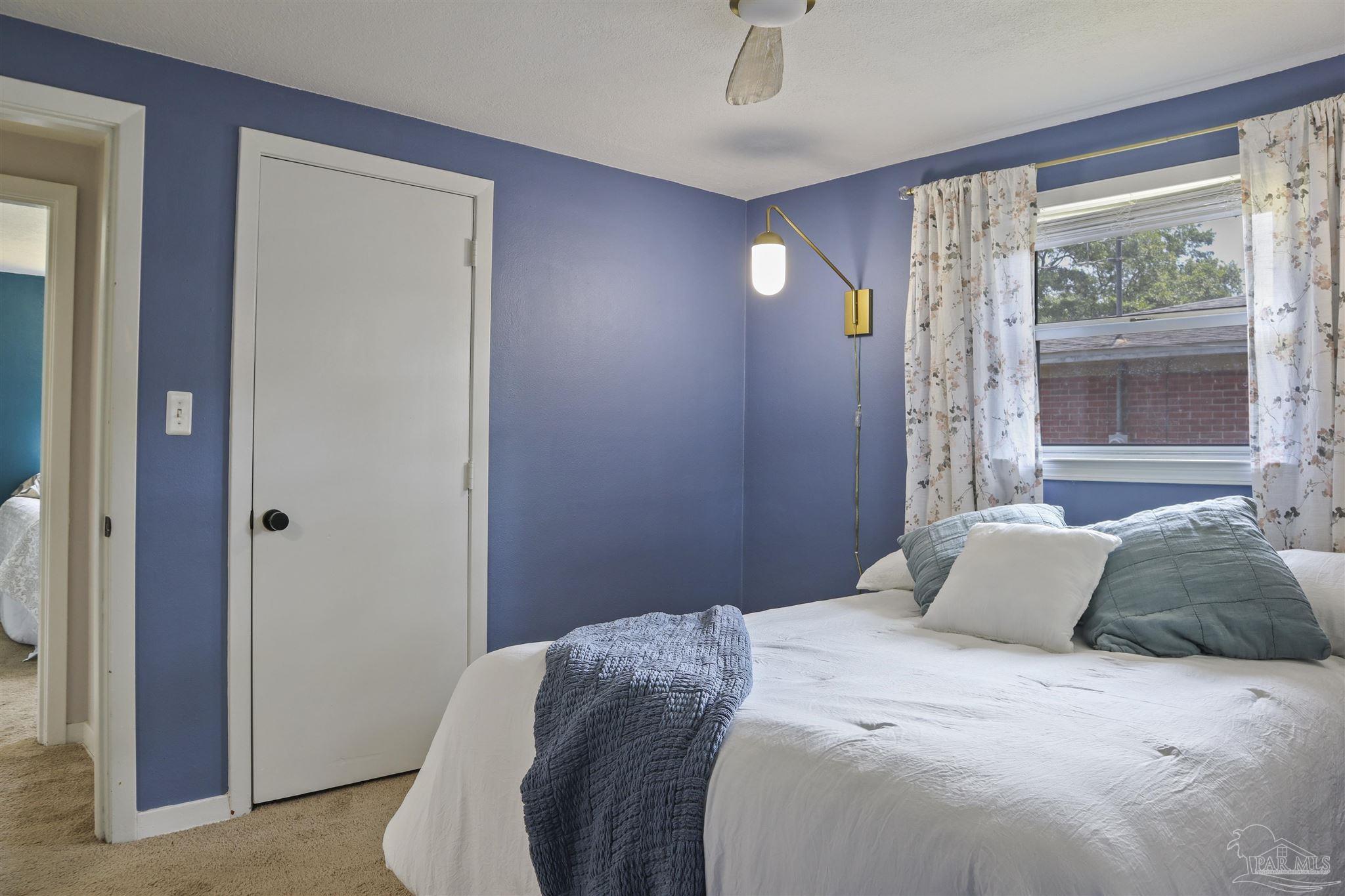 5925 Prince Road Pensacola, FL 32503 - Photo 19 of 51 a bedroom with a bed and a window