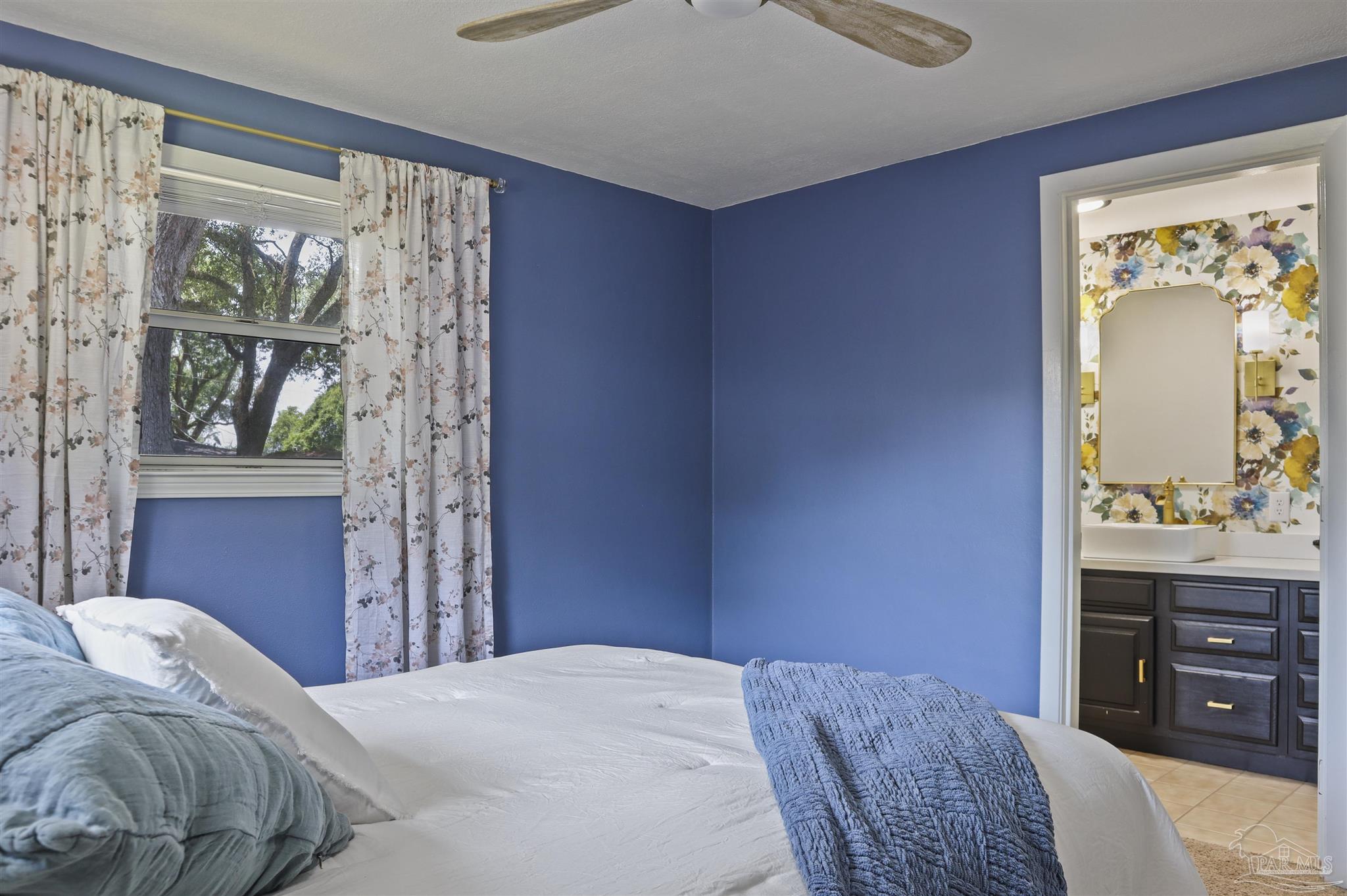 5925 Prince Road Pensacola, FL 32503 - Photo 20 of 51 a bedroom with a bed and a dresser
