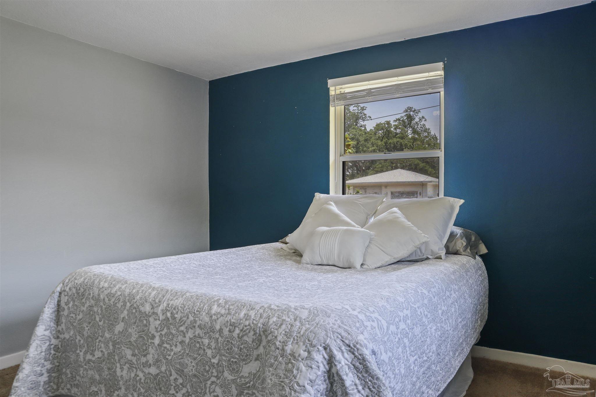 5925 Prince Road Pensacola, FL 32503 - Photo 23 of 51 a bedroom with a bed and window
