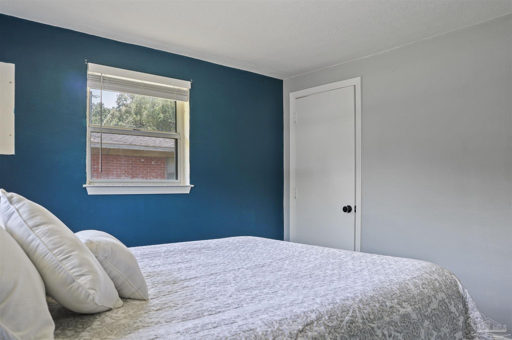 5925 Prince Road Pensacola, FL 32503 - Photo 24 of 51 a bedroom with a bed and a window