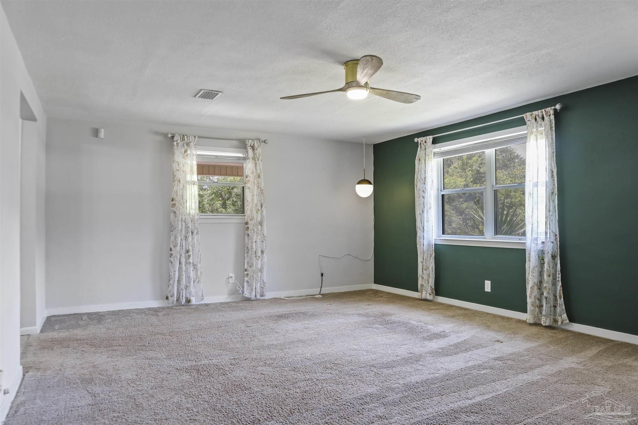 5925 Prince Road Pensacola, FL 32503 - Photo 3 of 51 an empty room with closet and windows