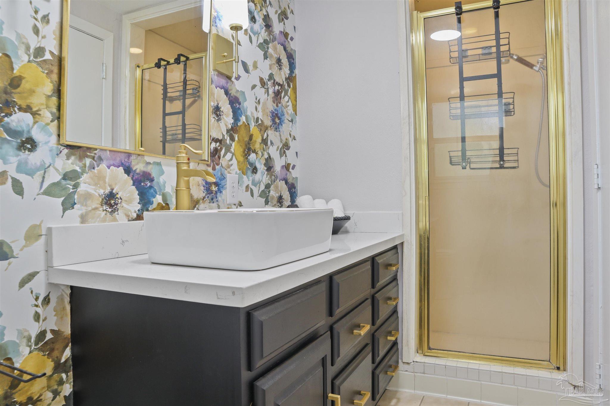 5925 Prince Road Pensacola, FL 32503 - Photo 31 of 51 a bathroom with a sink and a refrigerator