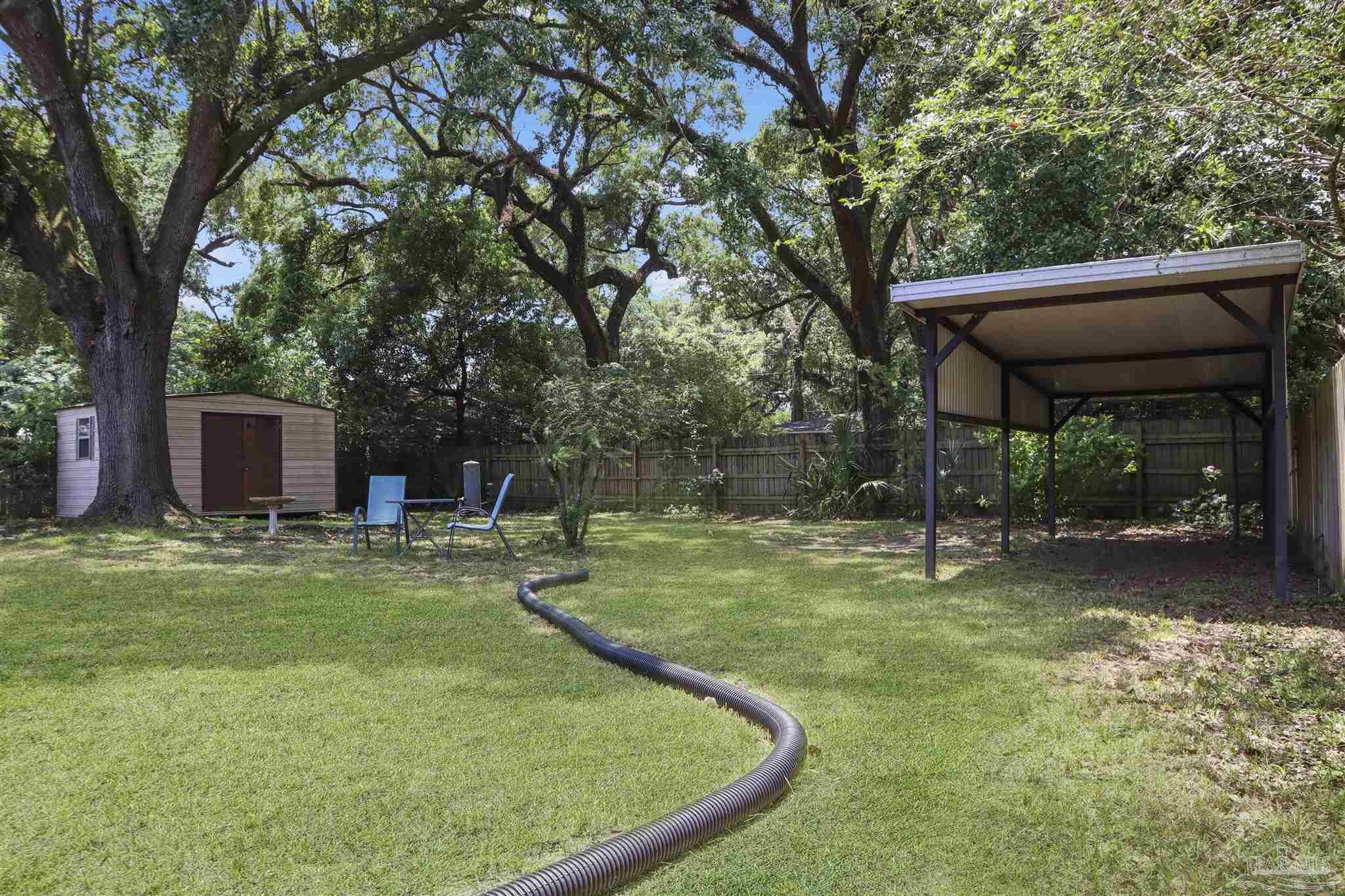 5925 Prince Road Pensacola, FL 32503 - Photo 34 of 51 a view of a house with backyard