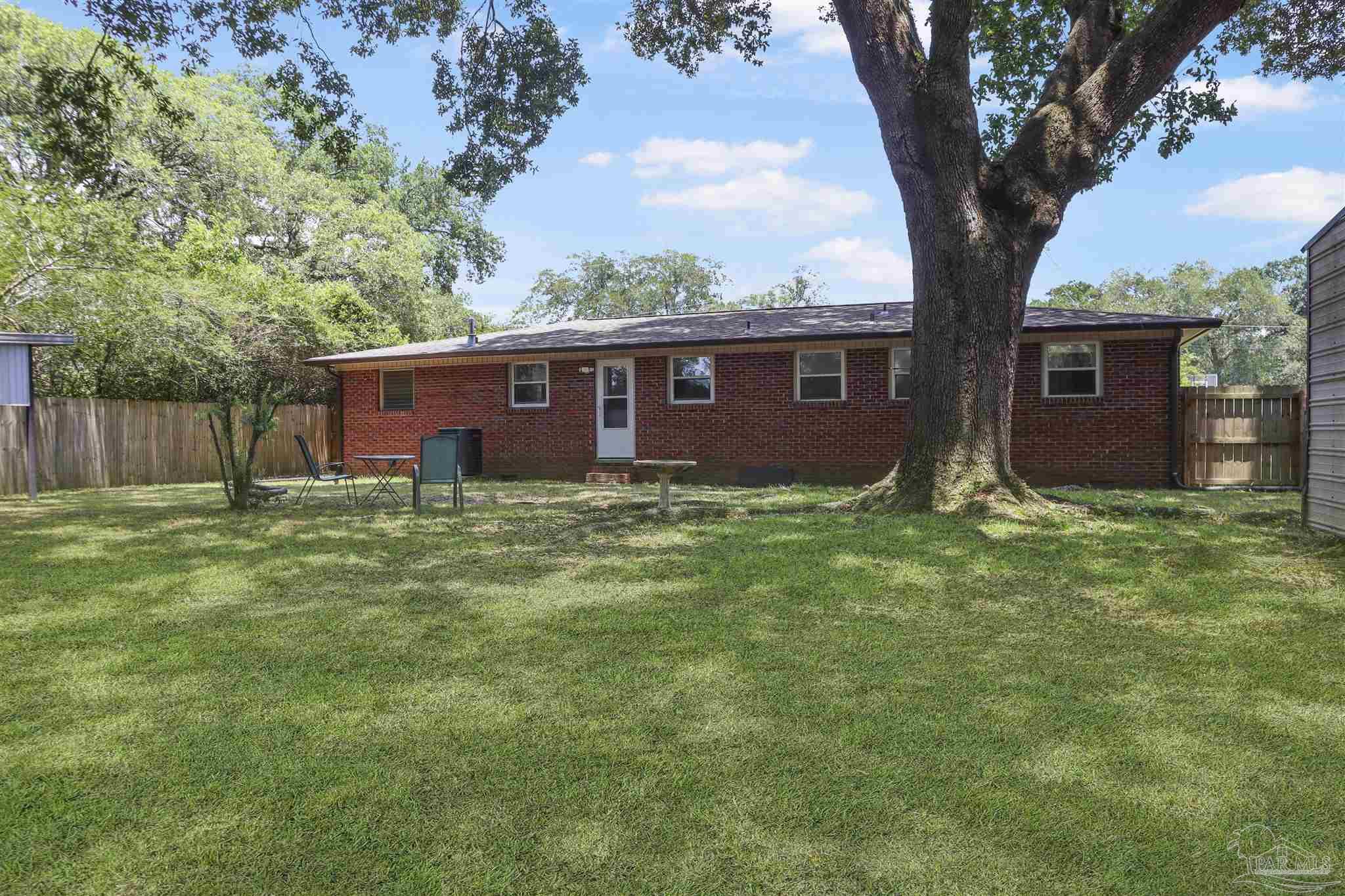 5925 Prince Road Pensacola, FL 32503 - Photo 36 of 51 front view of a house with a yard