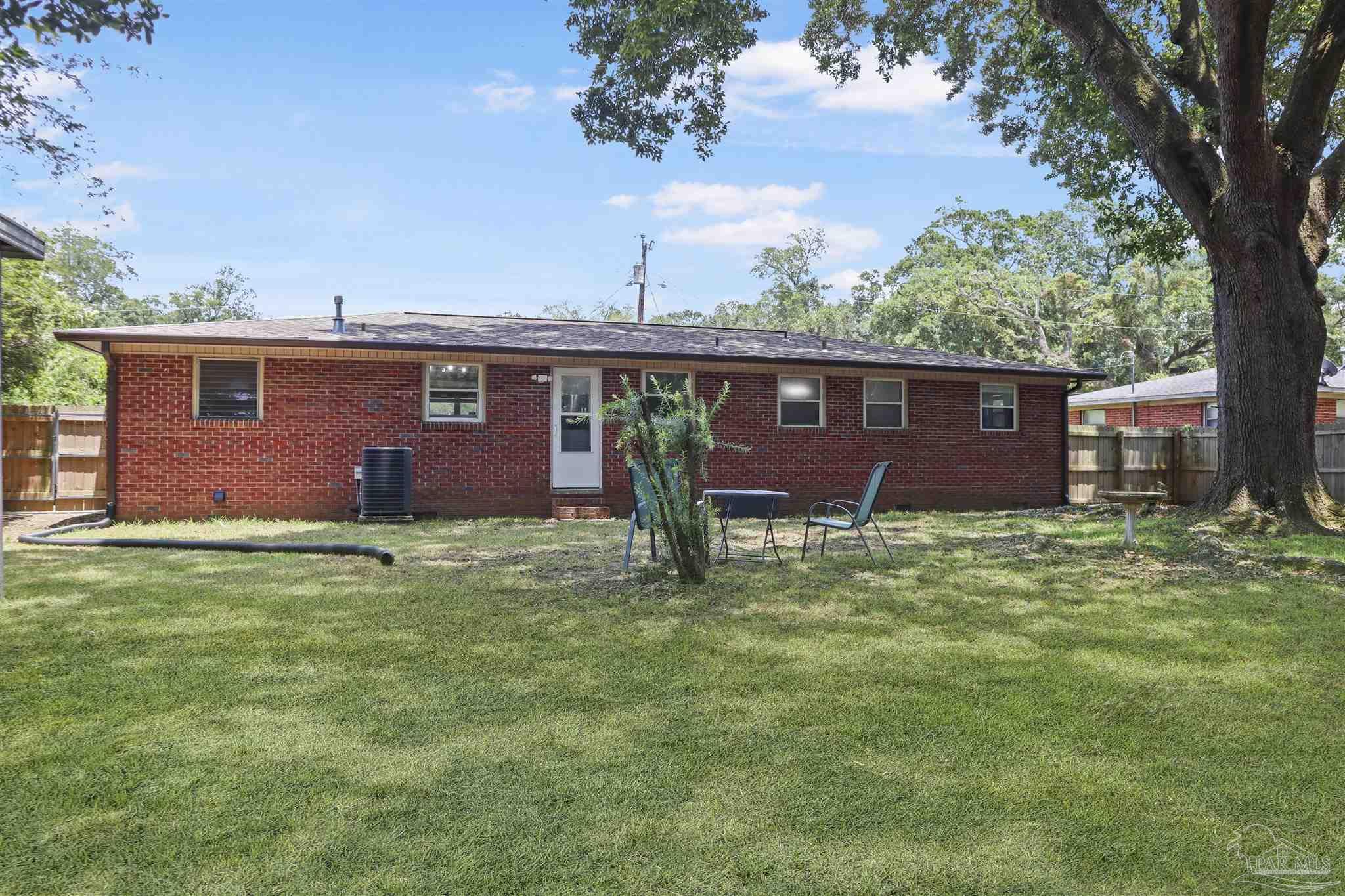 5925 Prince Road Pensacola, FL 32503 - Photo 38 of 51 a front view of a house with garden