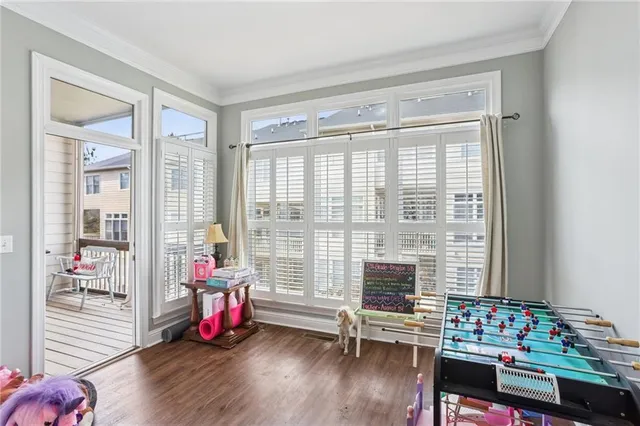 a bedroom with furniture and a window