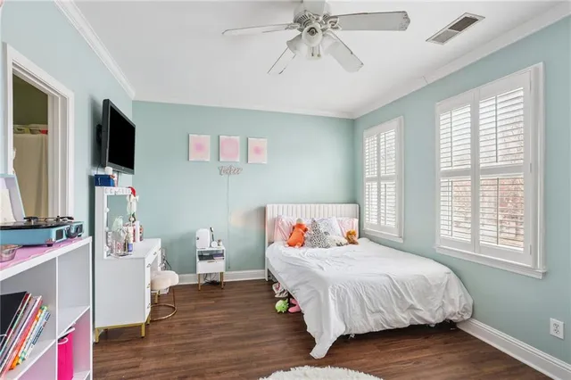a bathroom with a sink vanity mirror and toilet