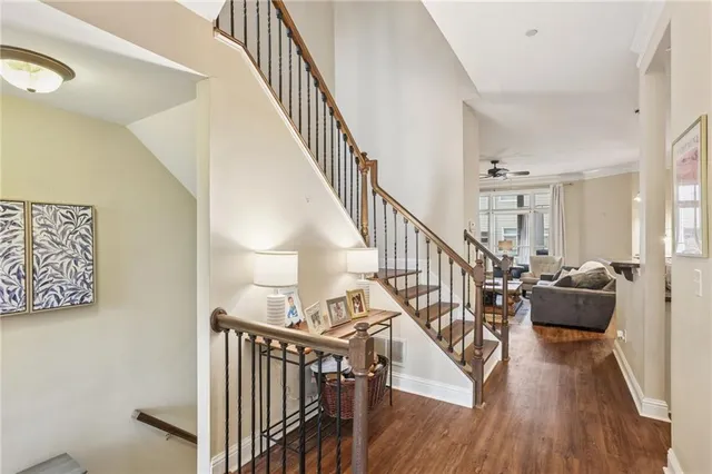 a view of entryway and hall with wooden floor