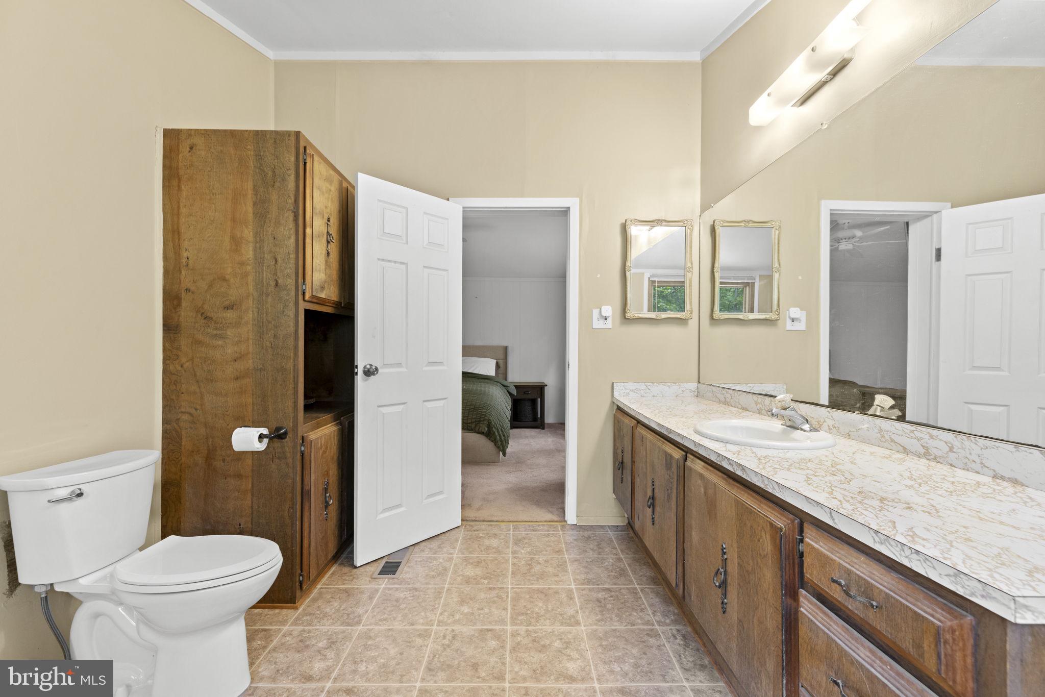 9448 Green Road Midland, VA 22728 - Photo 50 of 91 a spacious bathroom with a granite countertop sink a toilet and shower
