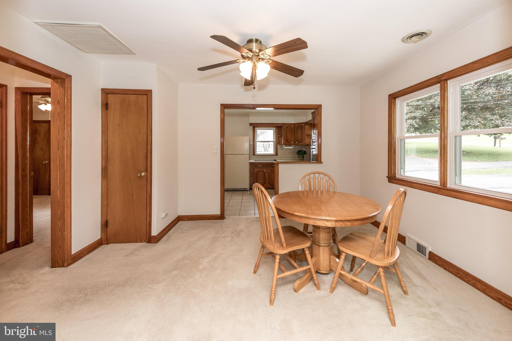 407 Wilgis Road Fallston, MD 21047 - Photo 13 of 37 a view of a dining room with furniture window and wooden floor