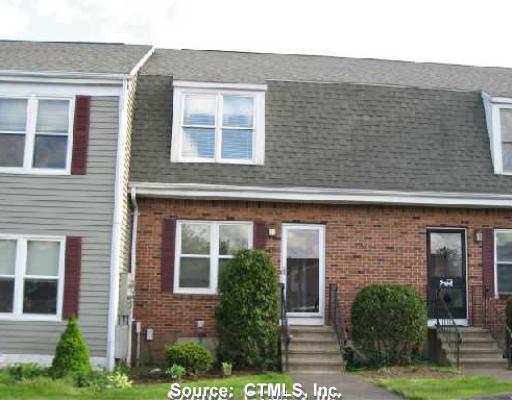 64 Summer Hill Road, Unit 64 Wallingford, CT 06492 - Photo 1 of 1 a view of a brick house with a yard next to a large window