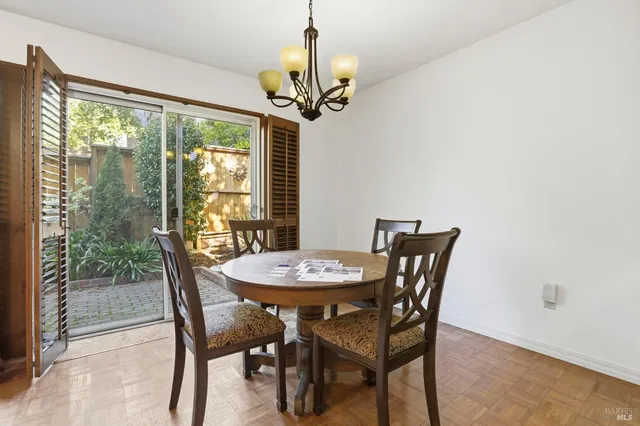a view of a dining room with furniture window and outside view