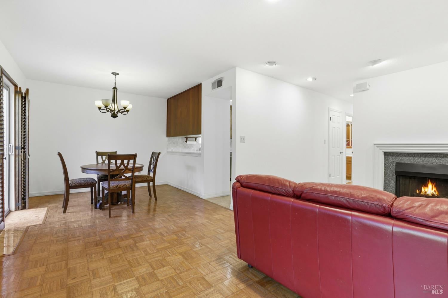 380 Sunset Way Mill Valley, CA 94941 - Photo 10 of 41 a living room with furniture a dining table and a fireplace