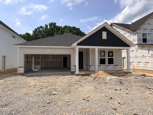 a view of front a house with a yard
