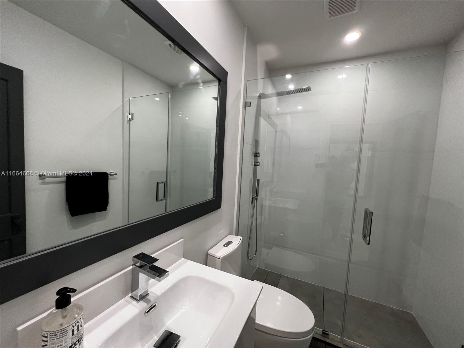 844 Southwest 8th Avenue Miami, FL 33130 - Photo 11 of 11 a bathroom with a sink a toilet and shower