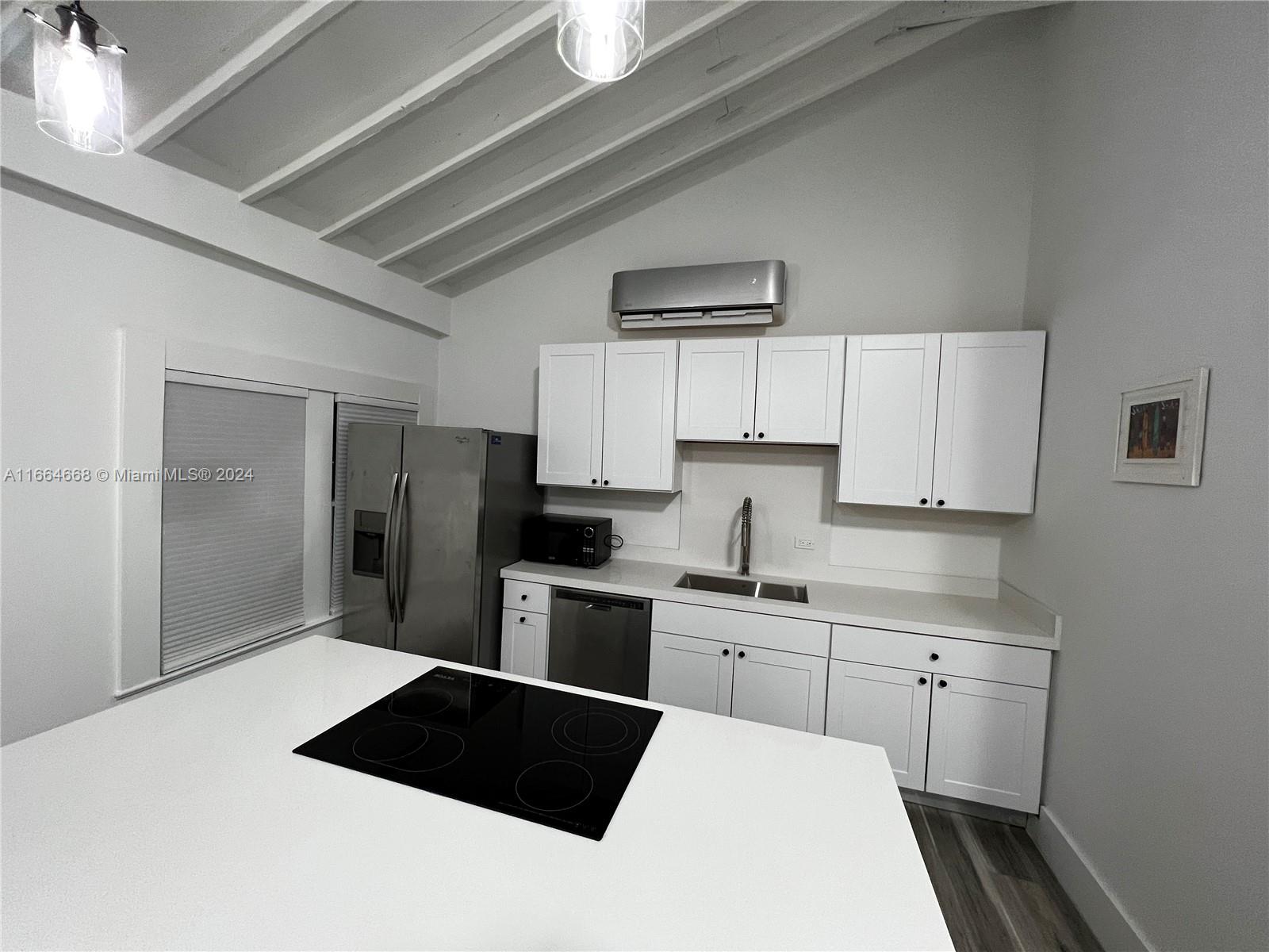 844 Southwest 8th Avenue Miami, FL 33130 - Photo 6 of 11 a kitchen with a sink stainless steel appliances and cabinets