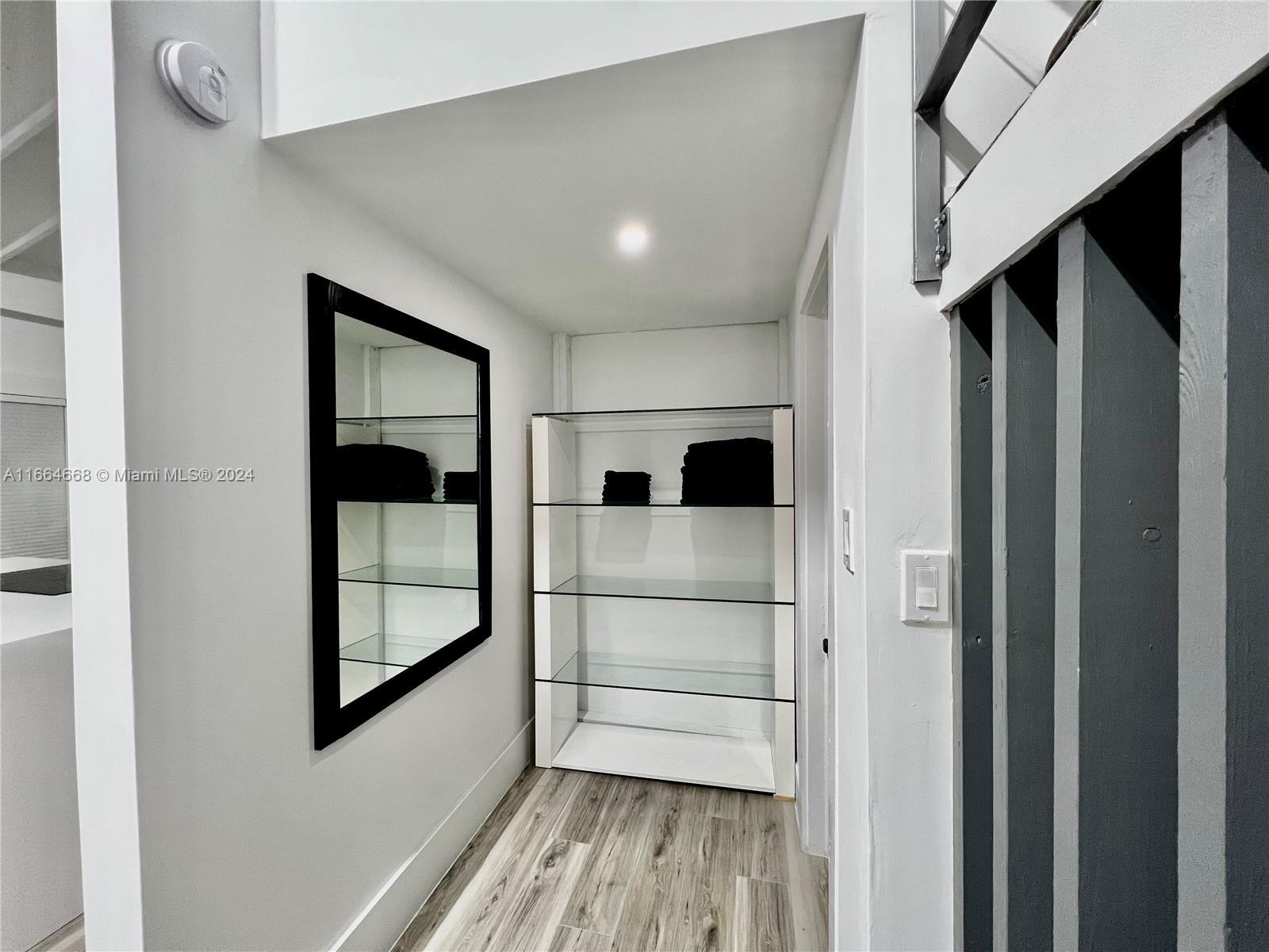 844 Southwest 8th Avenue Miami, FL 33130 - Photo 9 of 11 a view of a hallway with wooden floor and staircase