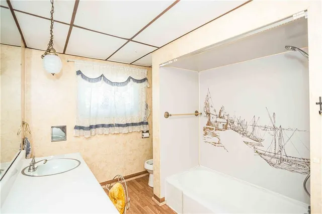 a bathroom with a bathtub and a shower