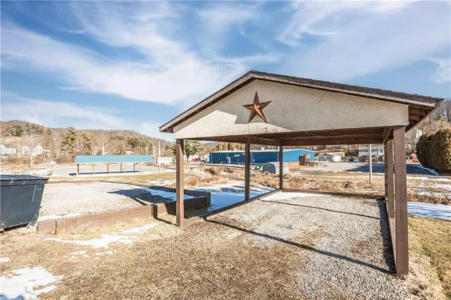 a backyard of a house with garden area and balcony