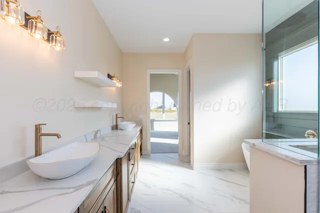 a bathroom with a granite countertop sink a toilet and a mirror