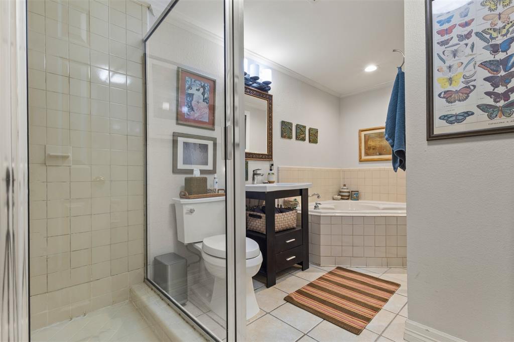 9461 Waterview Road Dallas, TX 75218 - Photo 17 of 40 a bathroom with a granite countertop sink a toilet and shower