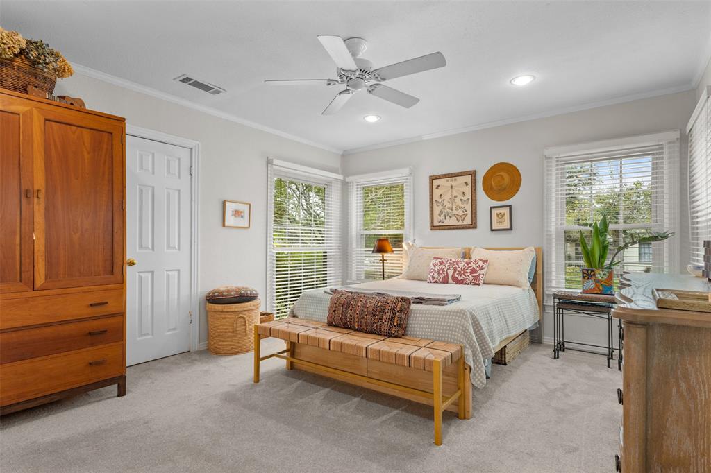 9461 Waterview Road Dallas, TX 75218 - Photo 21 of 40 a bedroom with a bed and a window