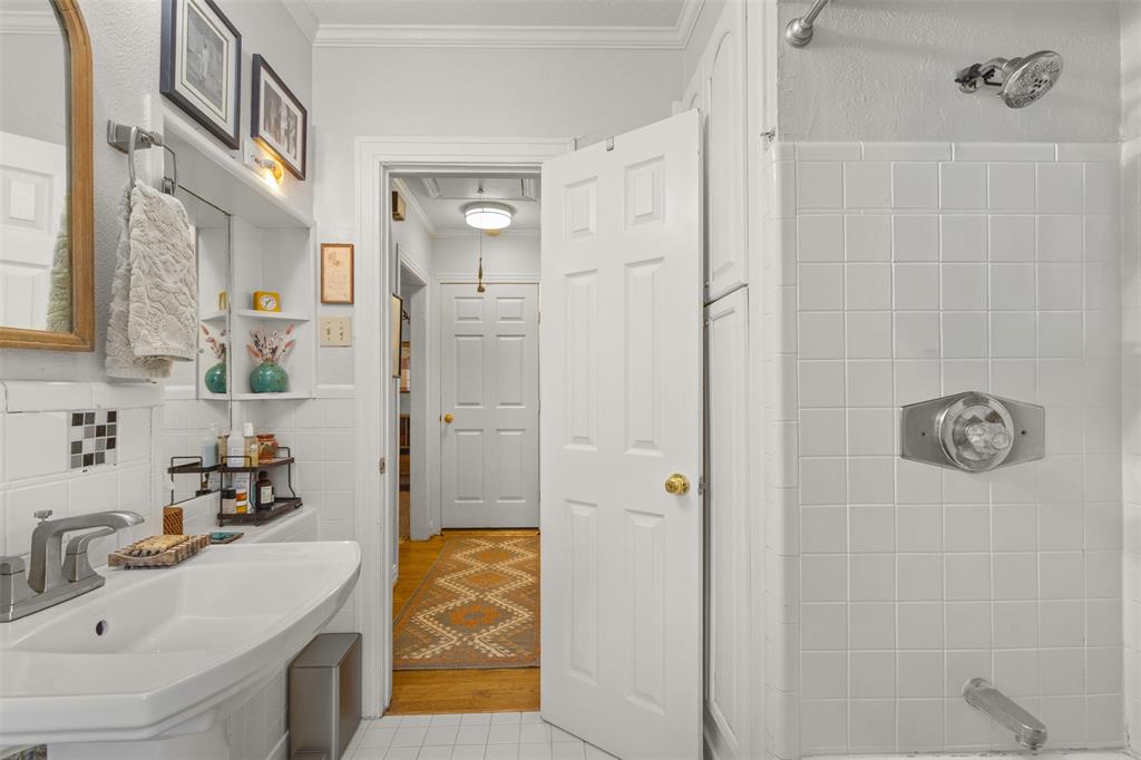 9461 Waterview Road Dallas, TX 75218 - Photo 27 of 40 a bathroom with a granite countertop shower sink and mirror