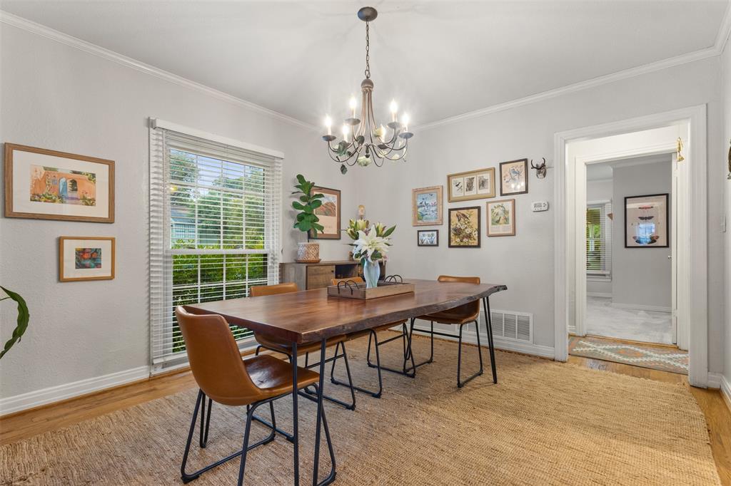 9461 Waterview Road Dallas, TX 75218 - Photo 10 of 40 a view of a dining room with furniture window and wooden floor