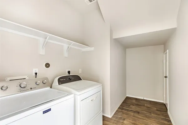 a utility room with dryer and washer