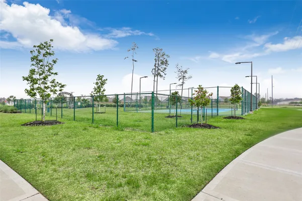 an aerial view of residential house with outdoor space and ocean view