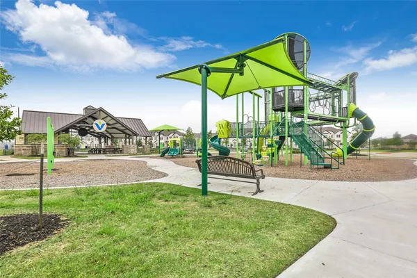 an aerial view of a residential houses with outdoor space