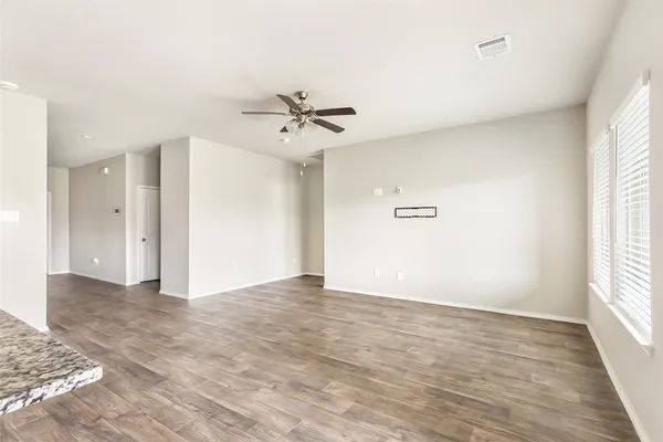 a view of an empty room with a window