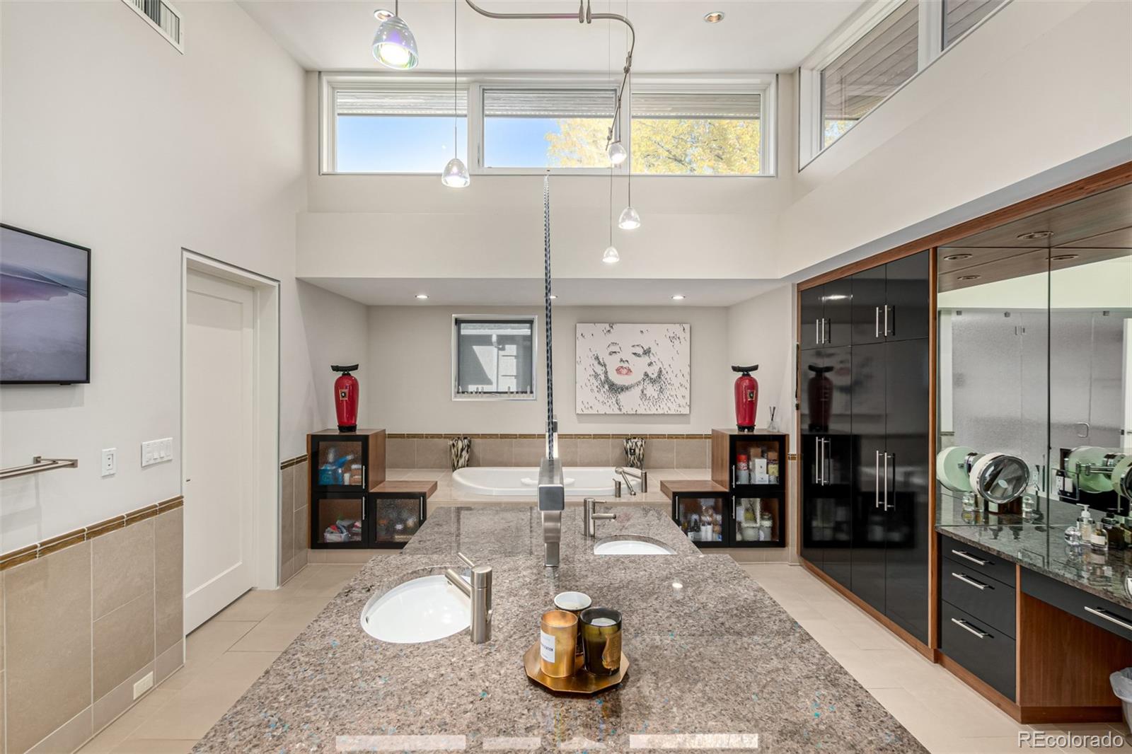 301 Monroe Street Denver, CO 80206 - Photo 23 of 44 a kitchen with refrigerator and stove