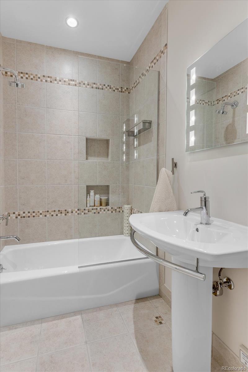 301 Monroe Street Denver, CO 80206 - Photo 28 of 44 a bathroom with a sink and a mirror