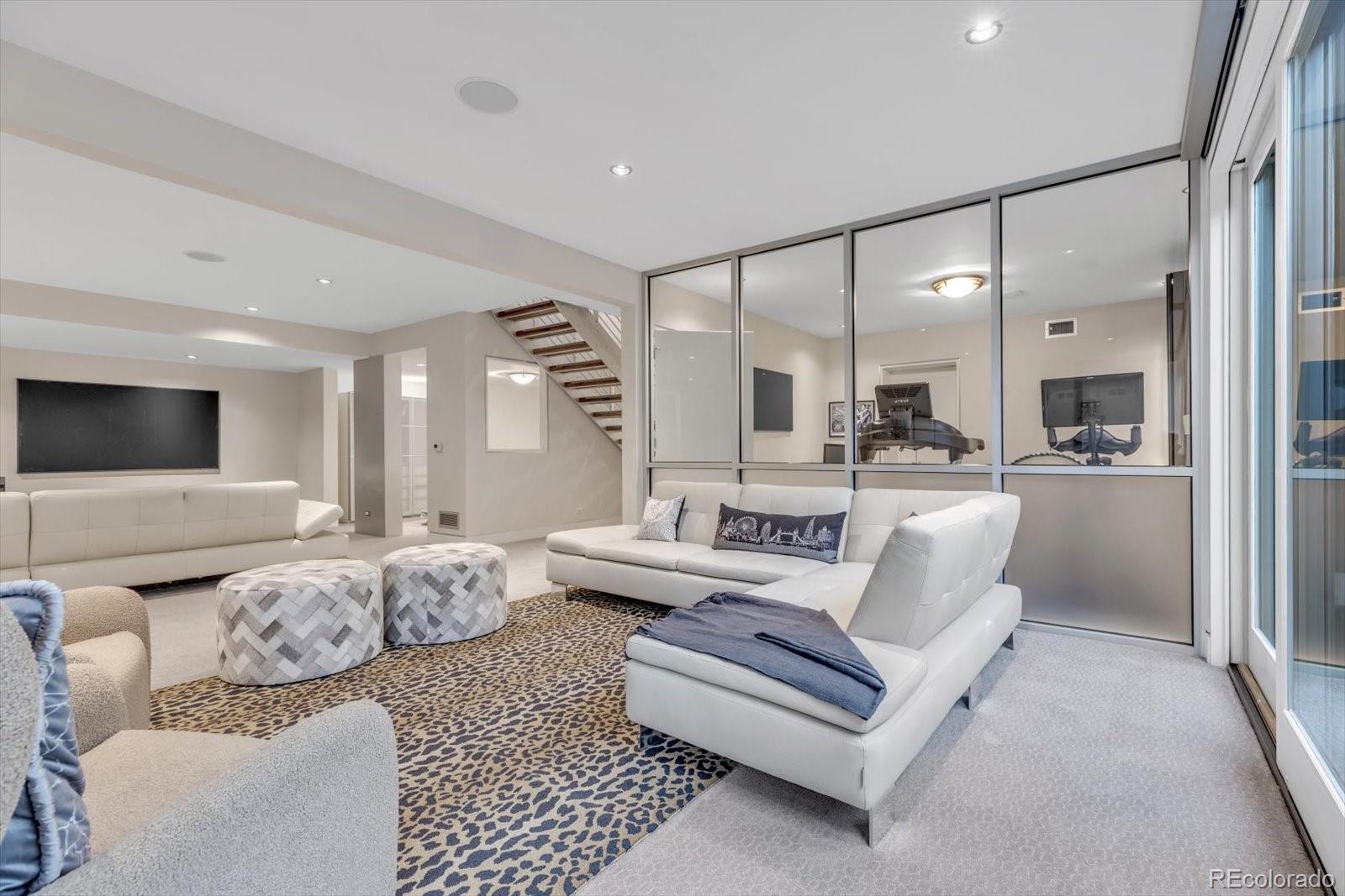 301 Monroe Street Denver, CO 80206 - Photo 33 of 44 a living room with furniture and view of kitchen