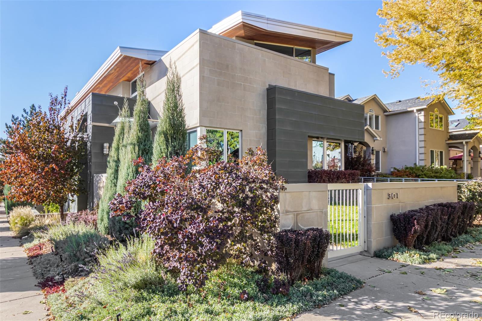 301 Monroe Street Denver, CO 80206 - Photo 42 of 44 a front view of a house with garden