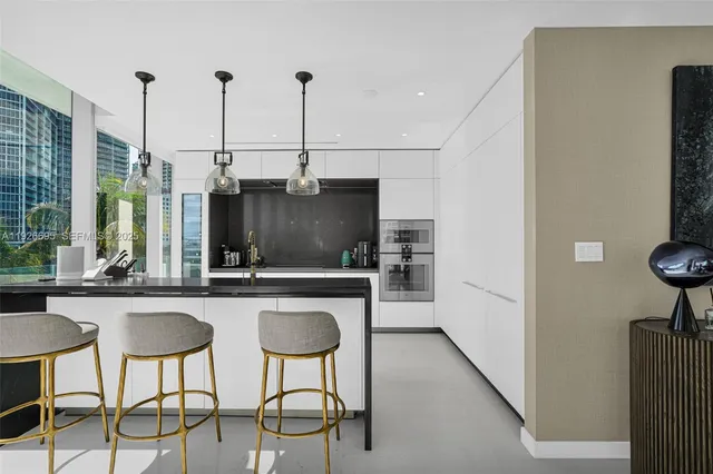 a living room with furniture white walls and white walls